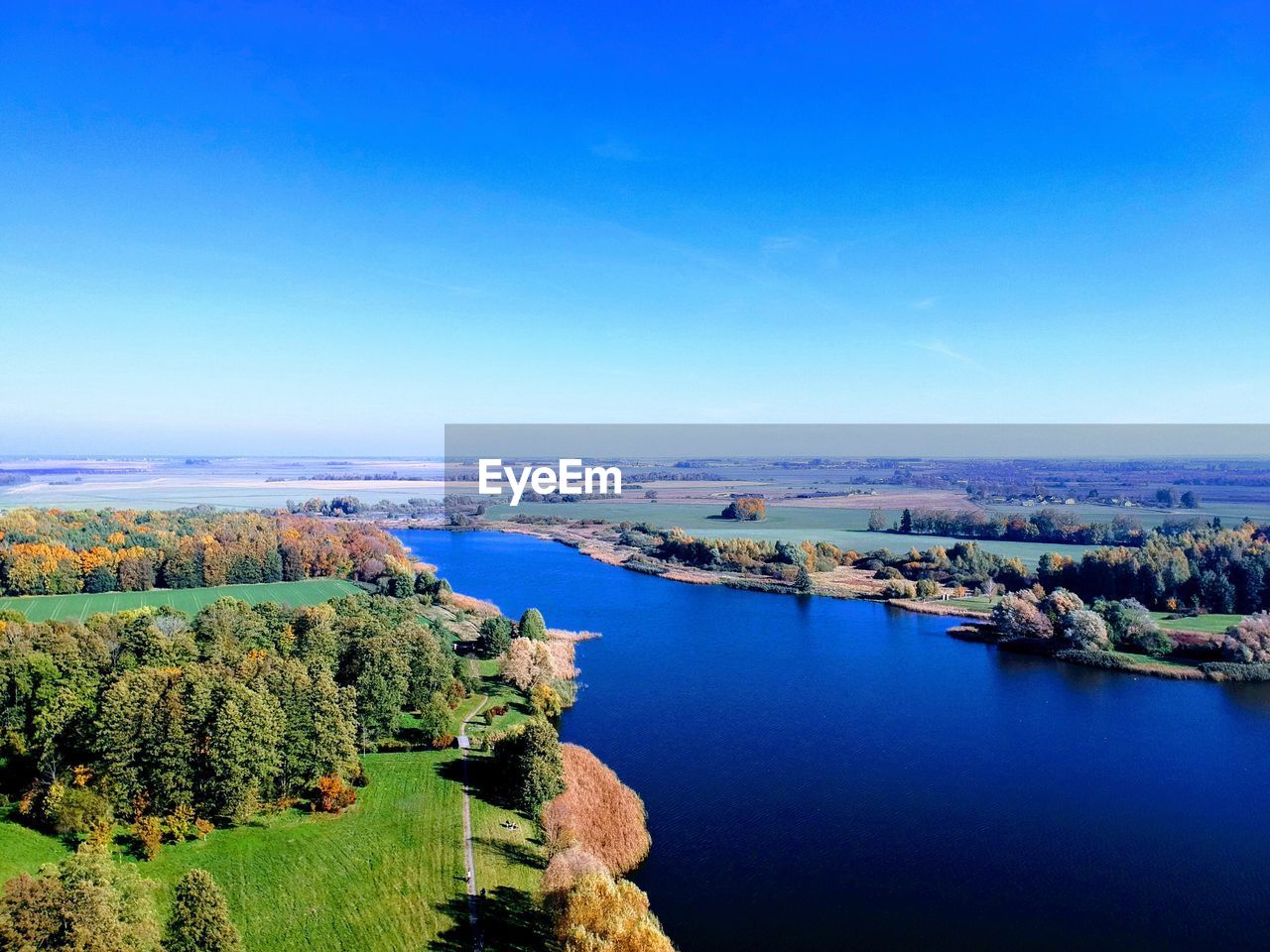 High angle view of river against clear blue sky