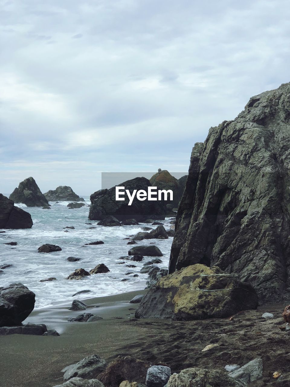 SCENIC VIEW OF SEA AND ROCK FORMATION