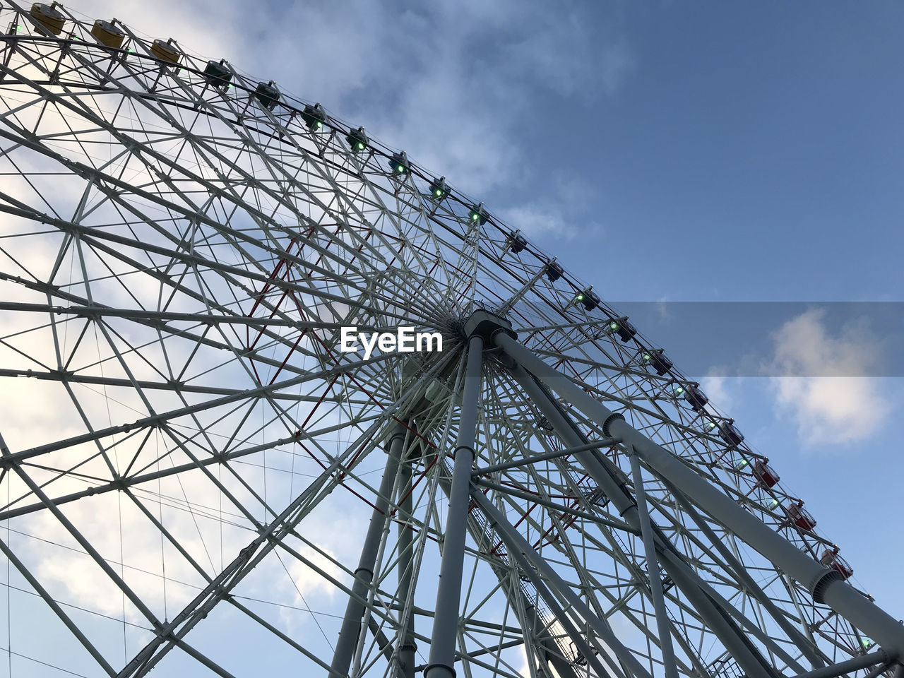 Low angle view of ferris wheel against sky