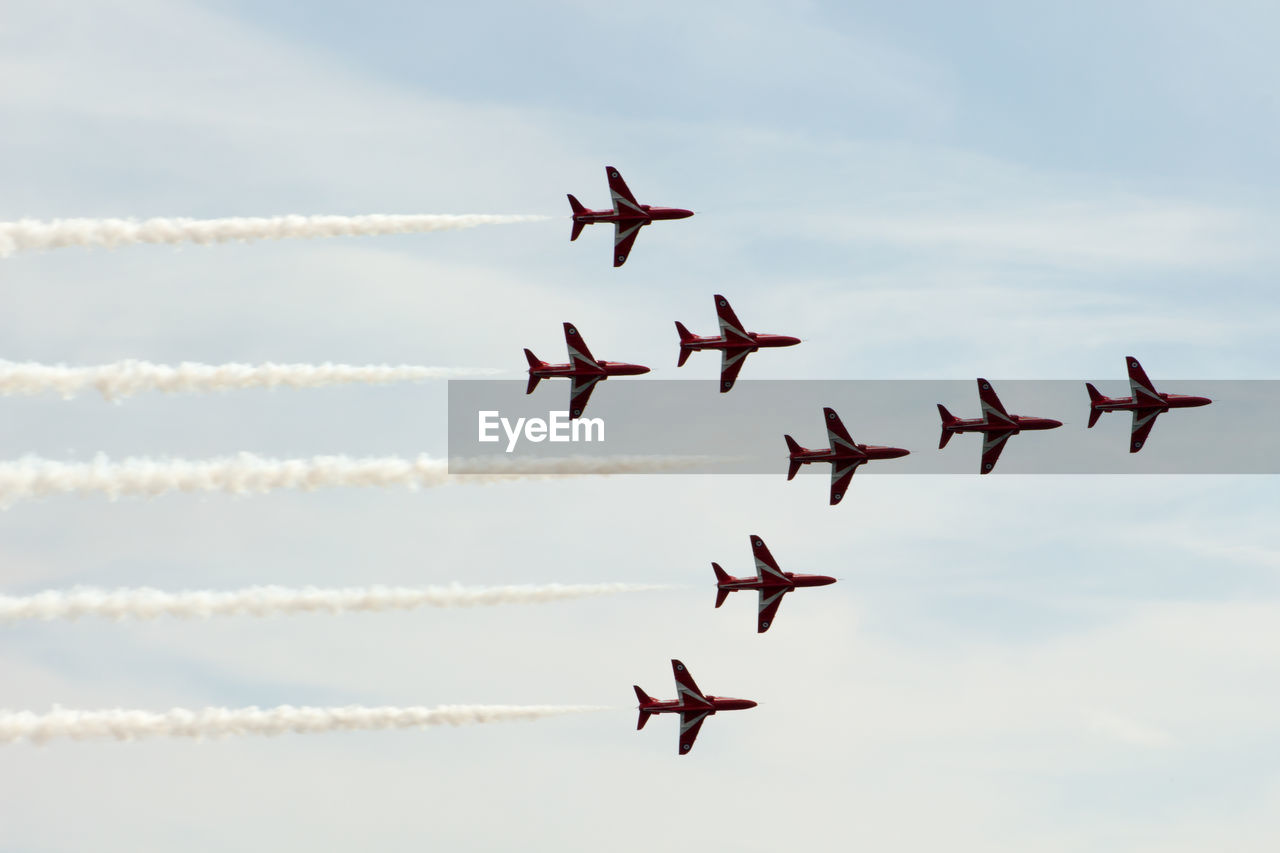 LOW ANGLE VIEW OF AIRSHOW IN FLIGHT