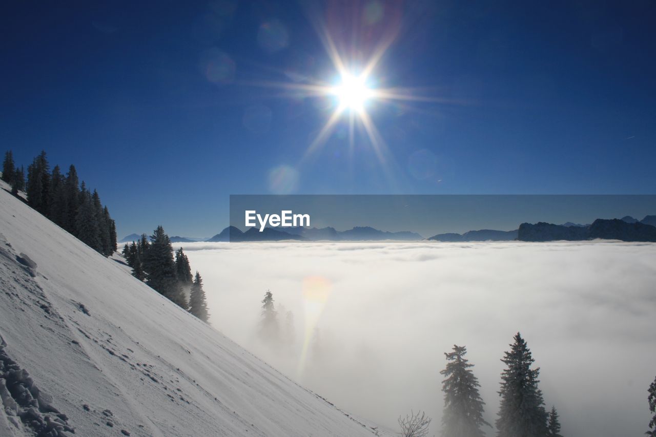 Scenic view of snow covered landscape against sky