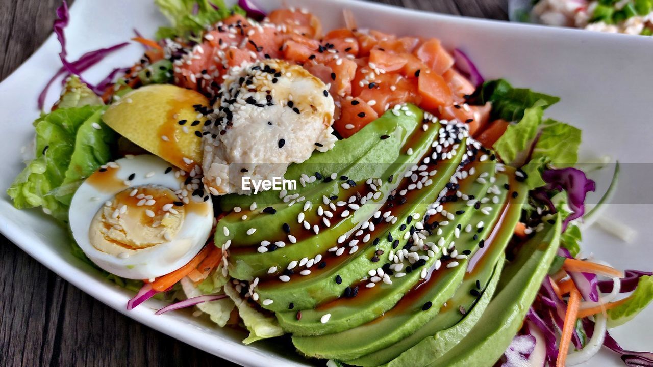 food, food and drink, healthy eating, salad, vegetable, wellbeing, freshness, plate, dish, produce, meal, fruit, no people, seafood, cuisine, lettuce, serving size, close-up, appetizer, sesame, indoors, green, table, high angle view