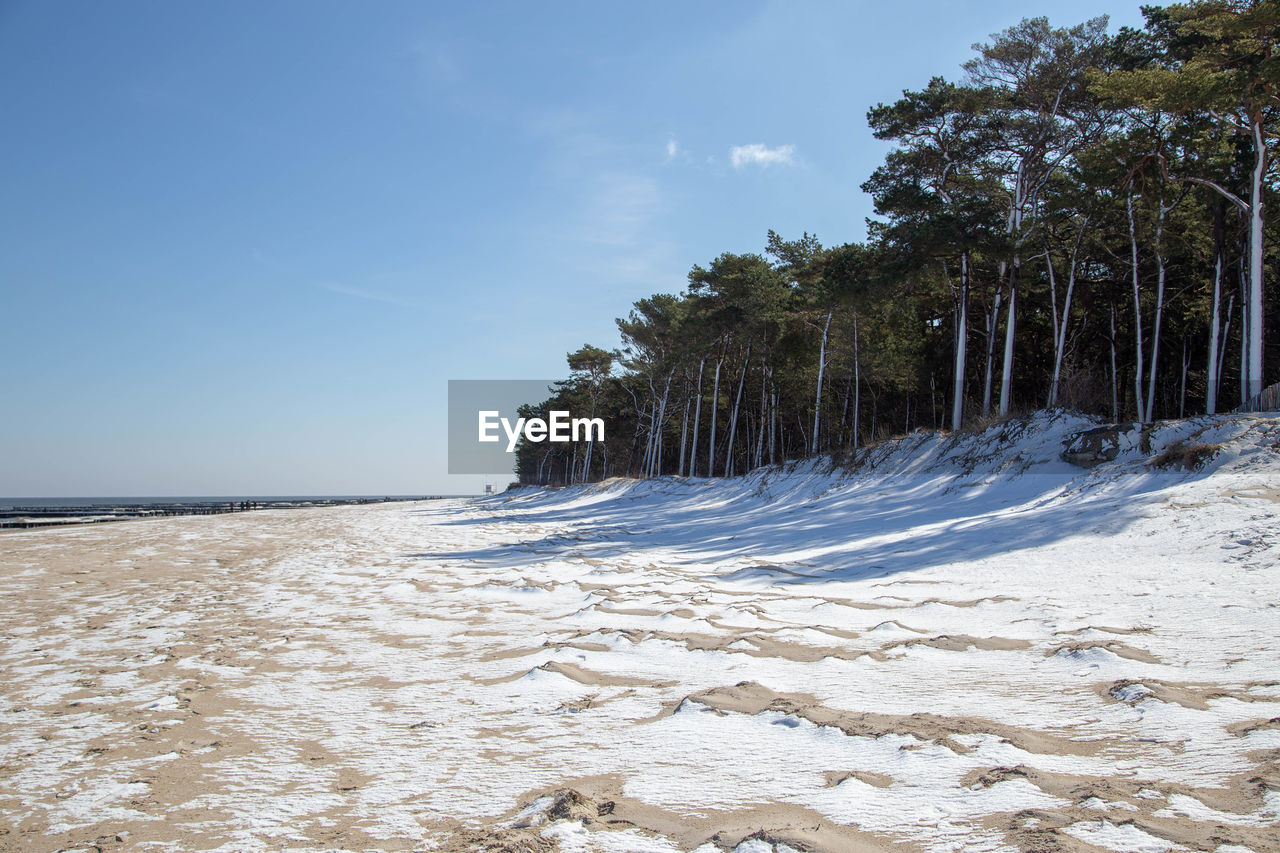 Scenic view of sea against sky during winter