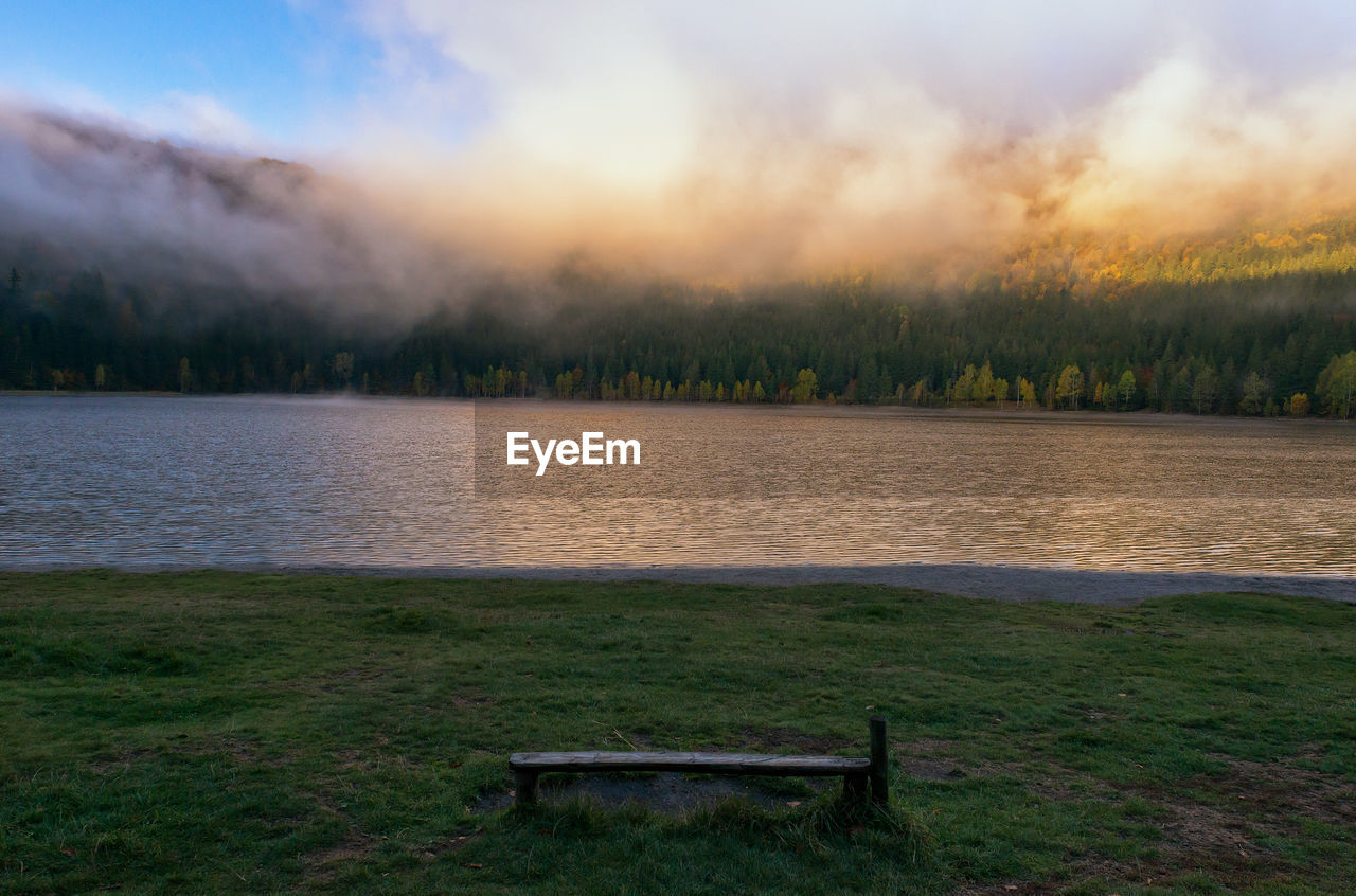 Scenic view of lake against sky during sunset