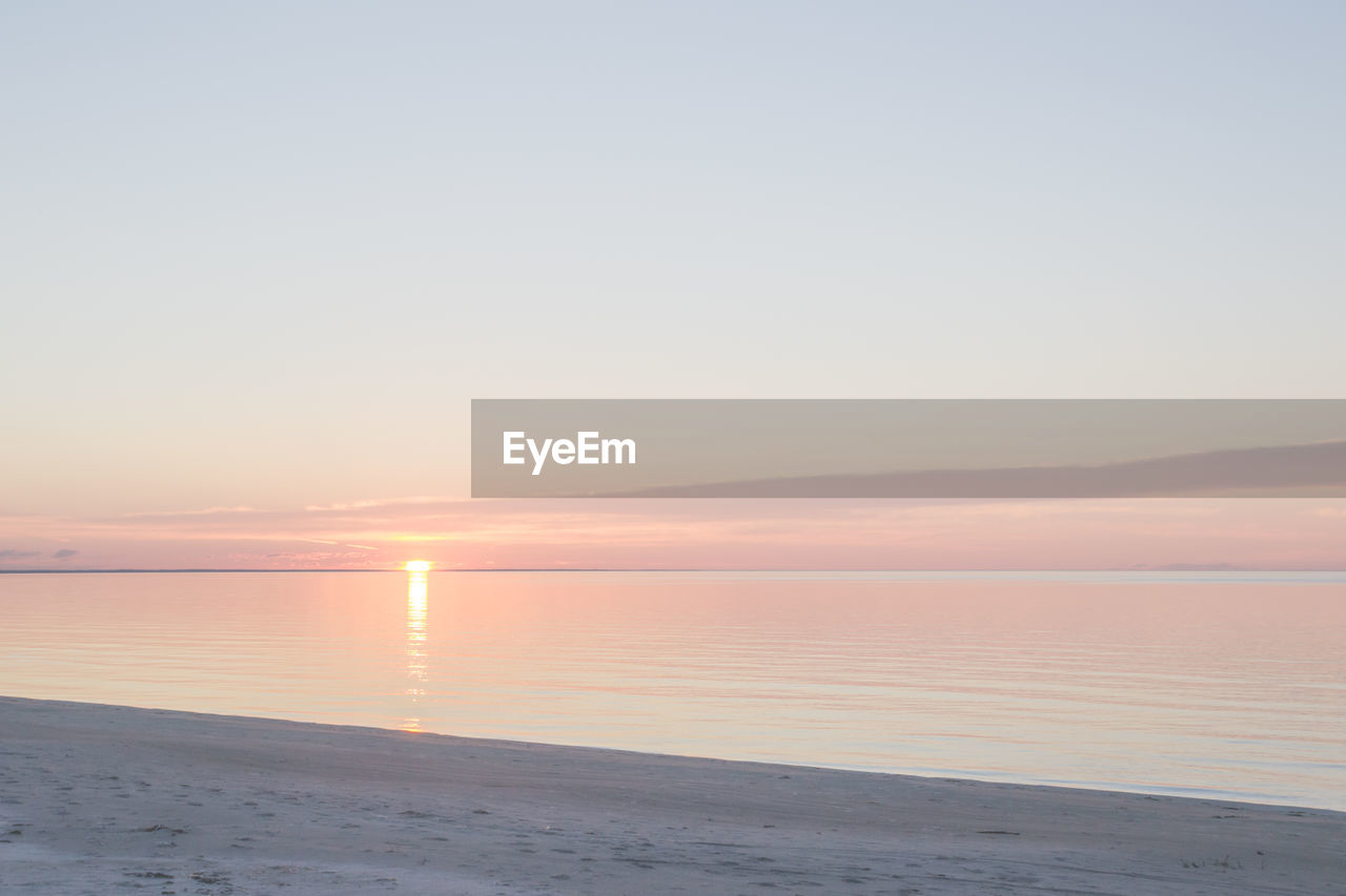 Scenic view of sea at sunset