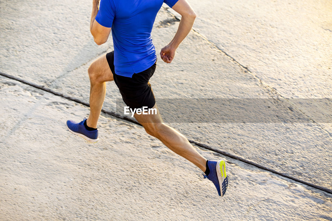 Athlete exercising on road