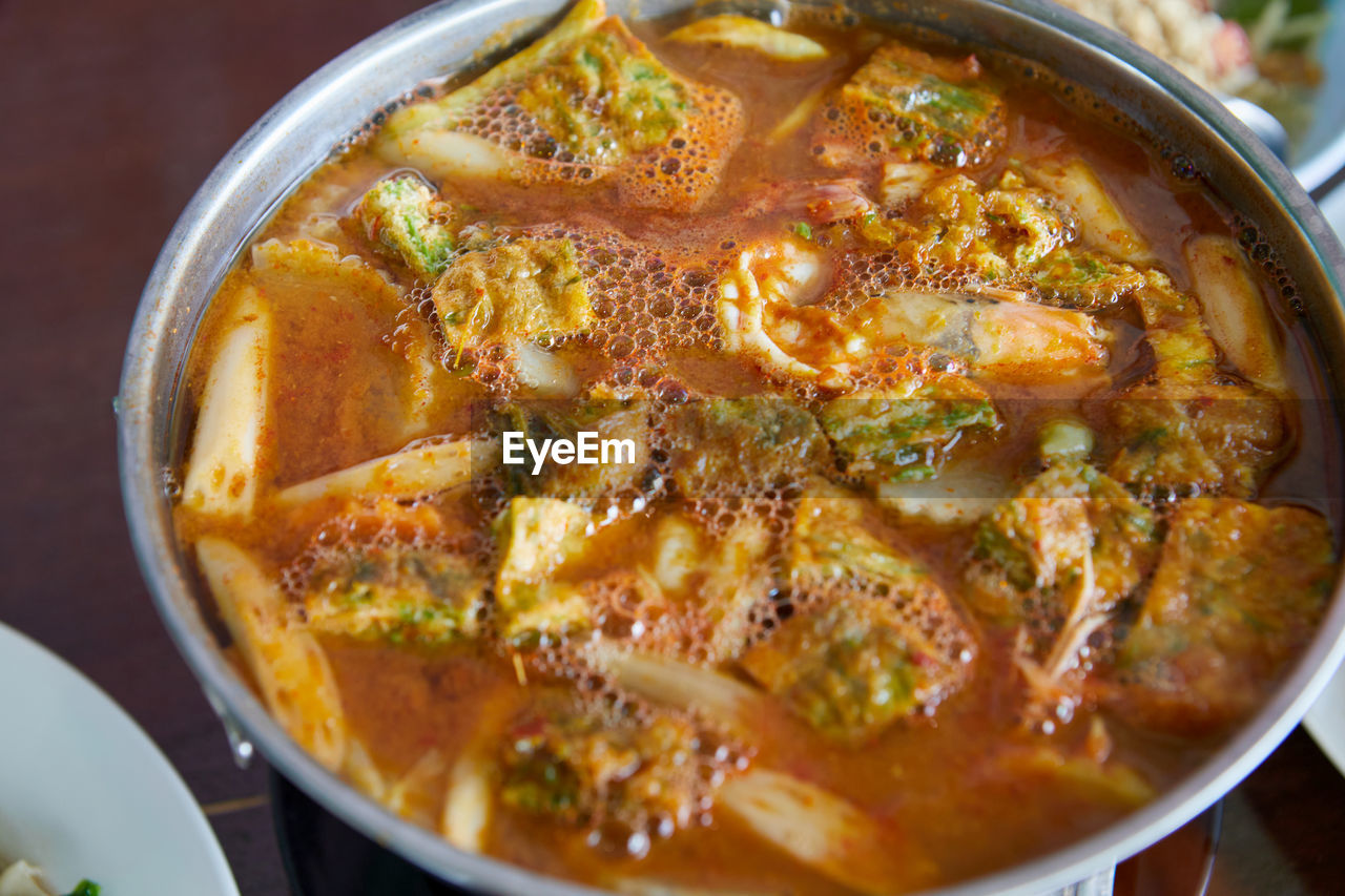 food, food and drink, healthy eating, curry, wellbeing, vegetable, freshness, dish, meat, bowl, stew, no people, spice, cuisine, kitchen utensil, thai food, produce, soup, indoors, asian food, close-up, table, indian food, meal, high angle view, household equipment, savory food, still life, crockery