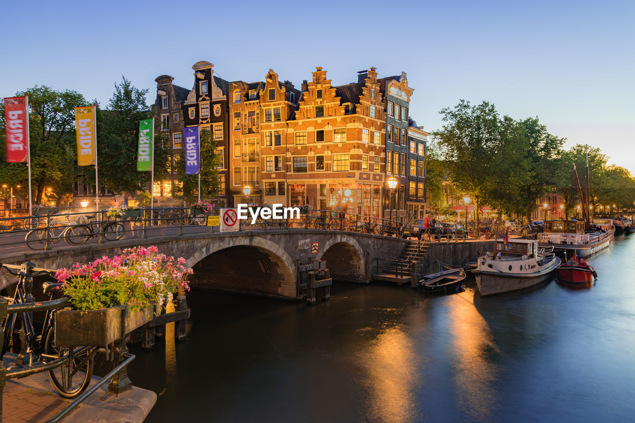 Amsterdam canals with bridge and traditional dutch houses, netherlands