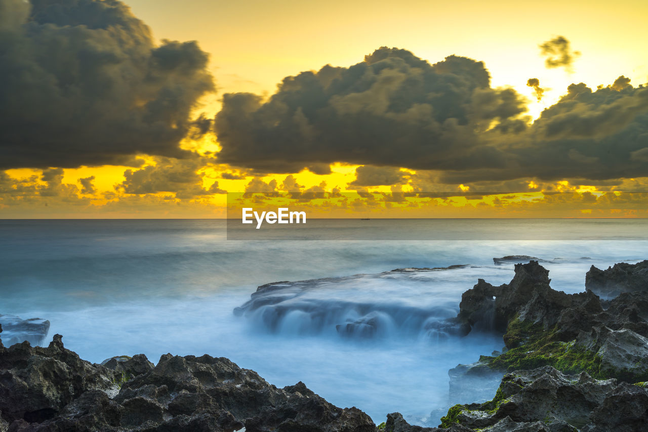 Scenic view of sea against sky during sunset