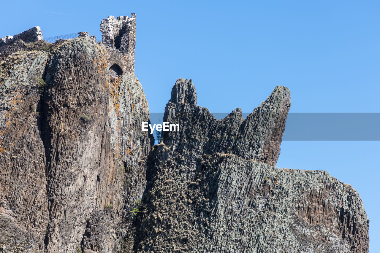 low angle view of rock formations