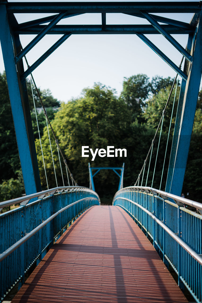 Footbridge against clear sky