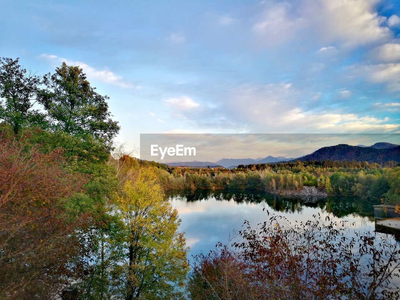 SCENIC VIEW OF LAKE AND MOUNTAINS