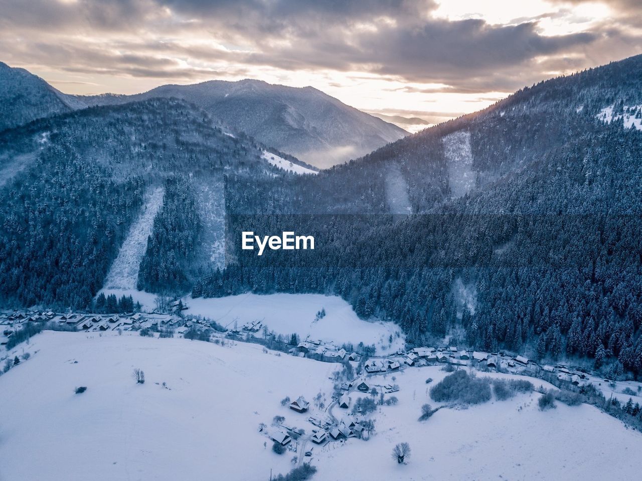 Scenic view of snowcapped mountains against sky