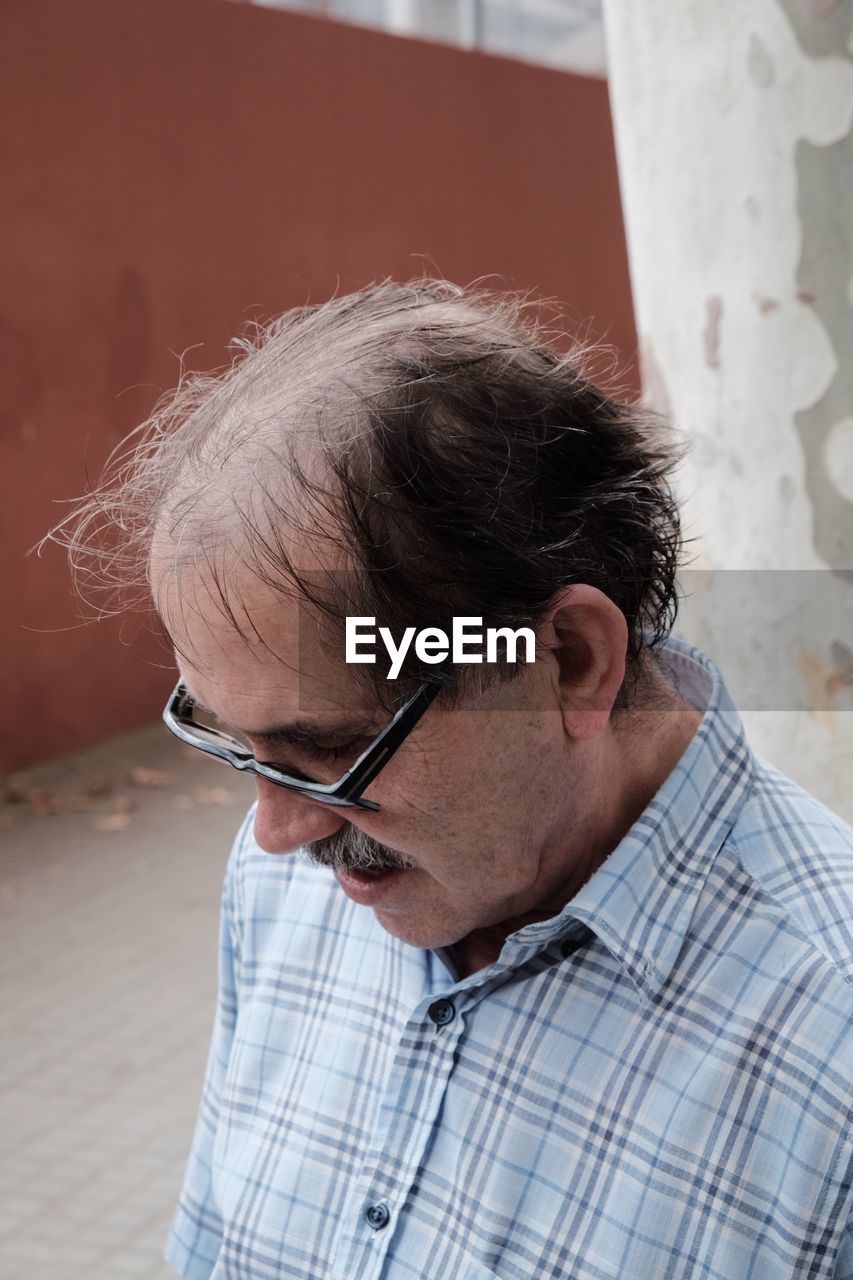 Close-up of senior man wearing eyeglasses