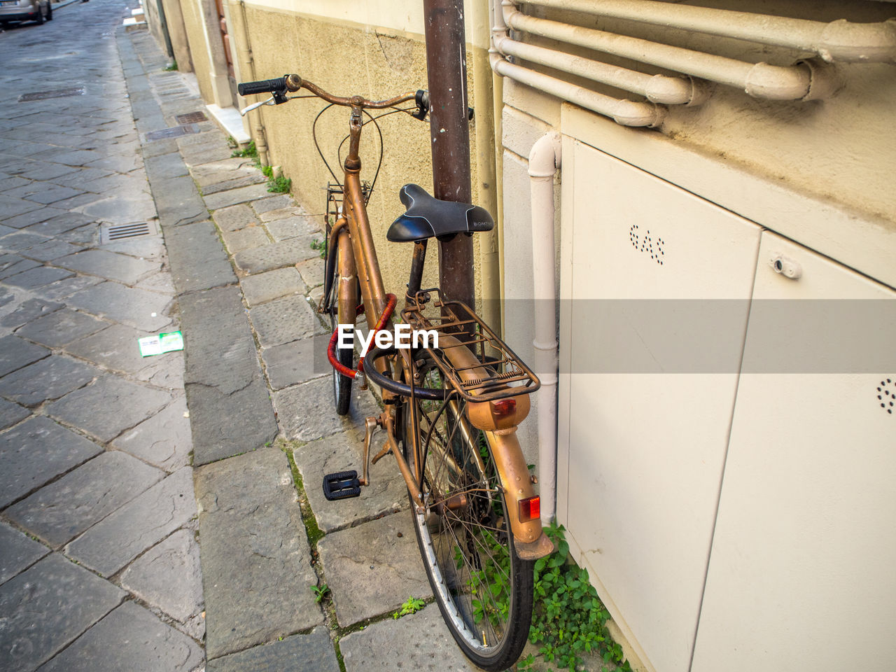 Bicycle parked on sidewalk
