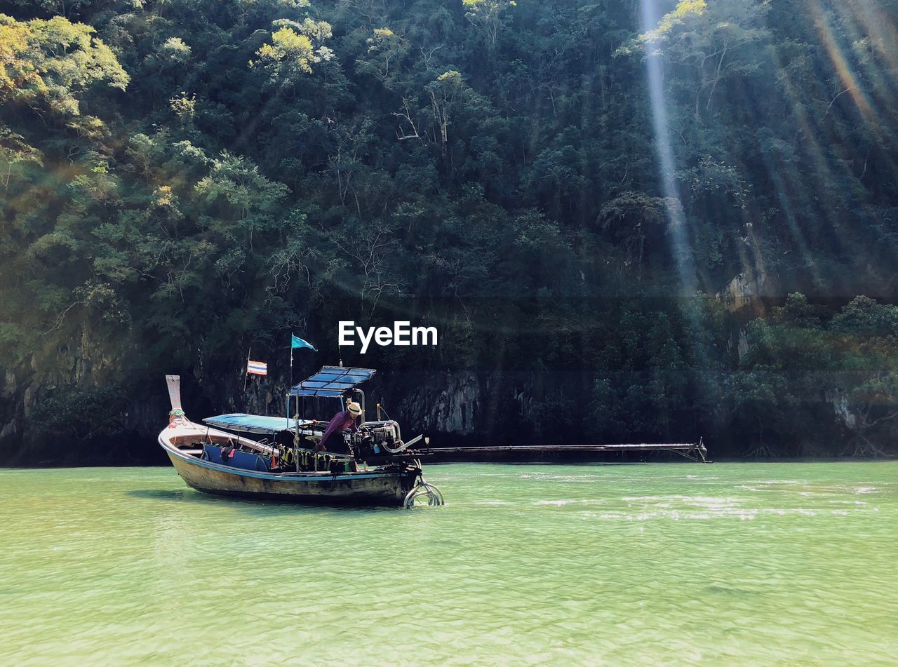 VIEW OF BOAT IN RIVER