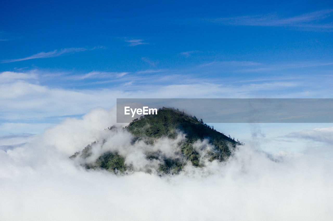 Scenic view of landscape against blue sky