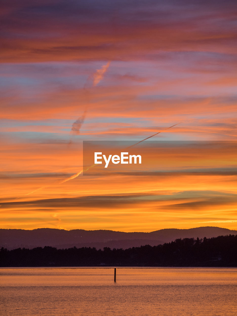 SCENIC VIEW OF SUNSET OVER SILHOUETTE LANDSCAPE