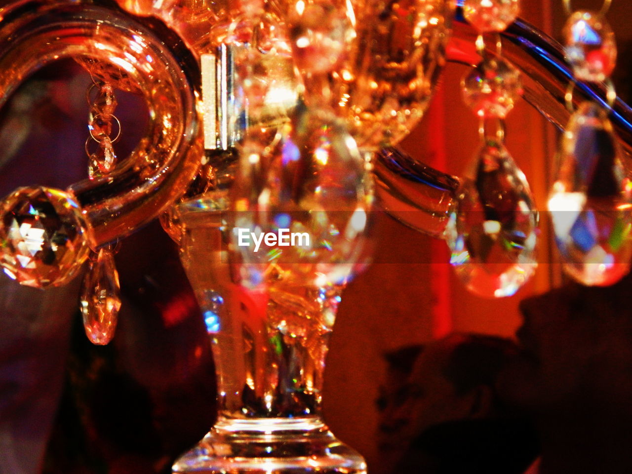 CLOSE-UP OF ILLUMINATED LIGHTING EQUIPMENT HANGING AT MARKET STALL