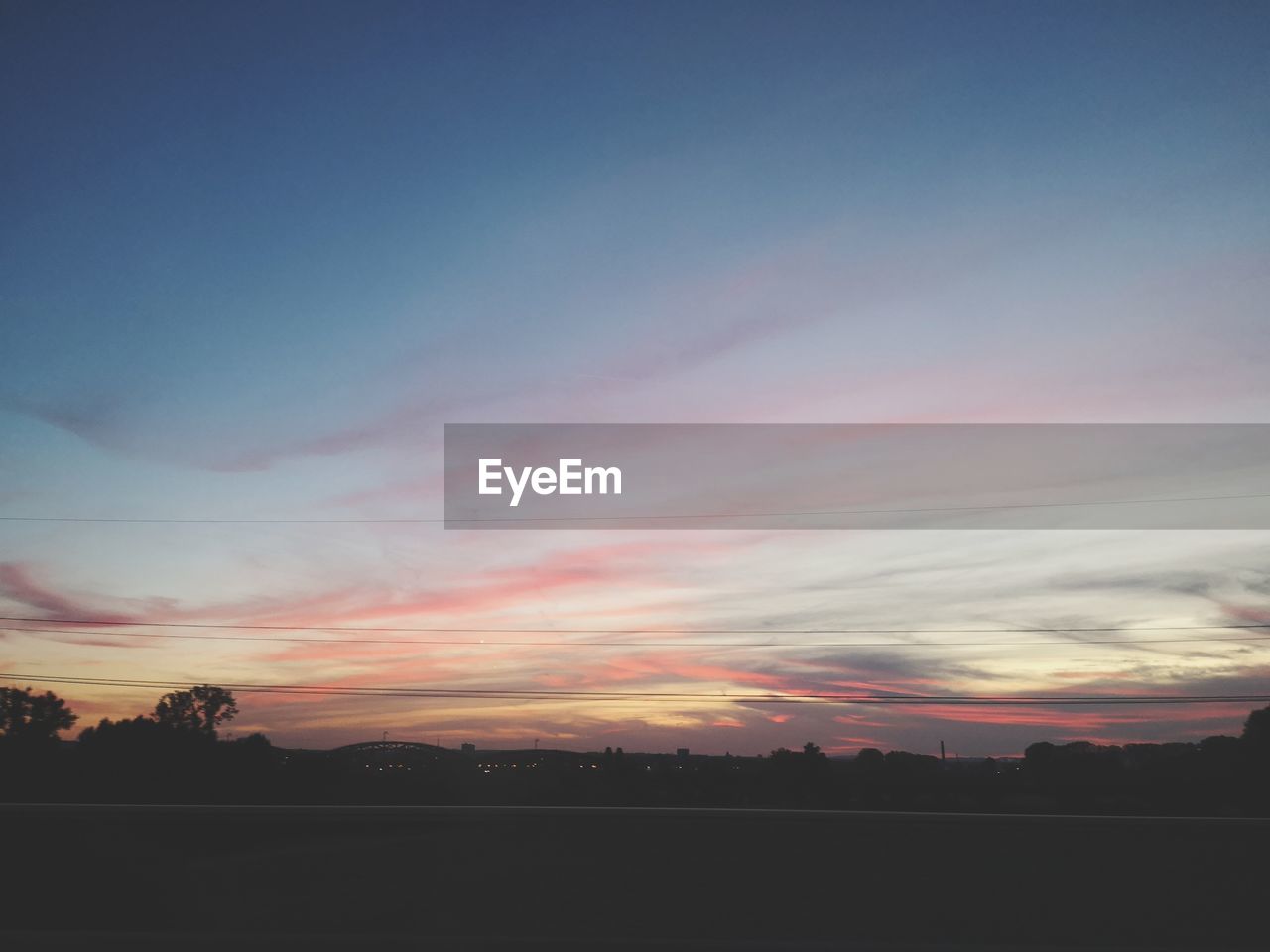 SILHOUETTE LANDSCAPE AGAINST SKY DURING SUNSET