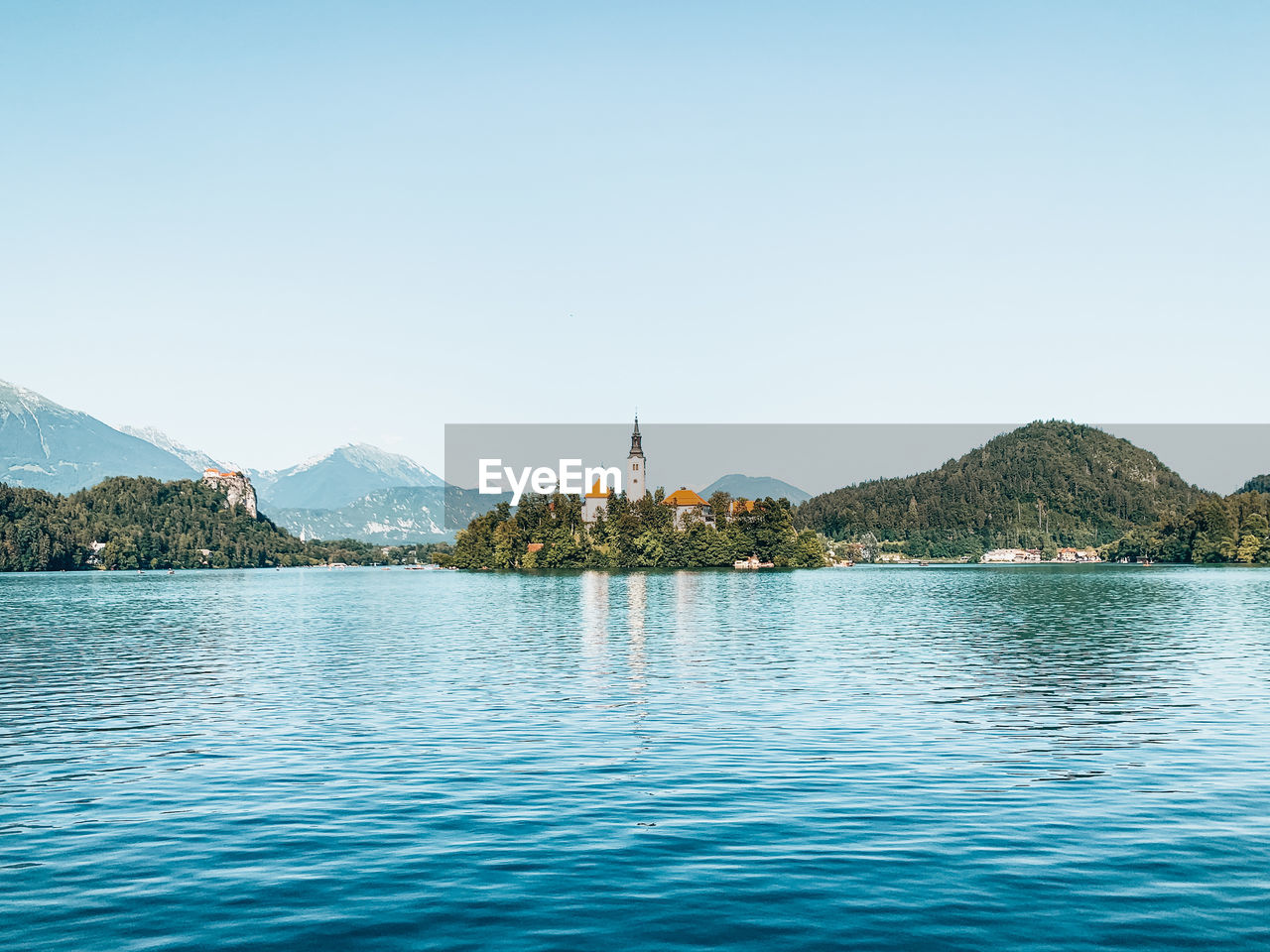 Scenic view of lake bled against sky