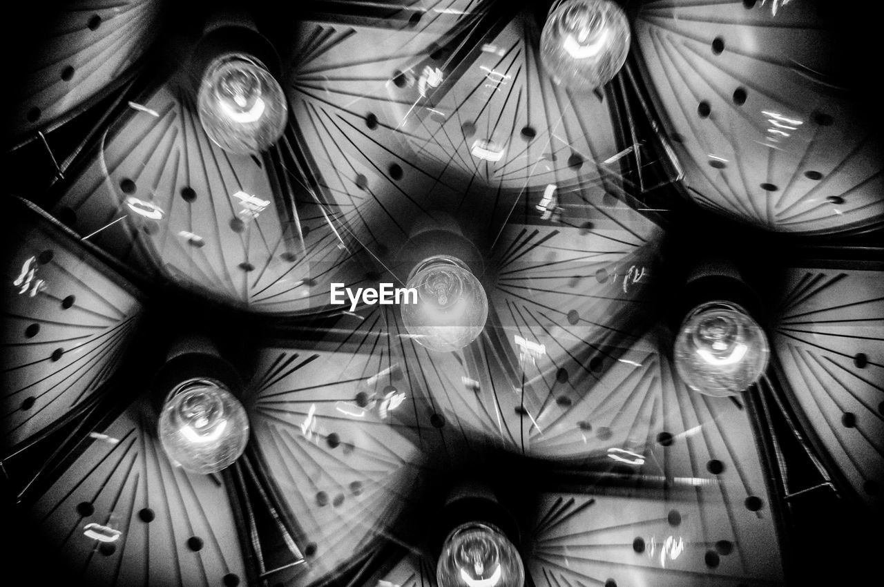 Low angle view of illuminated light bulbs