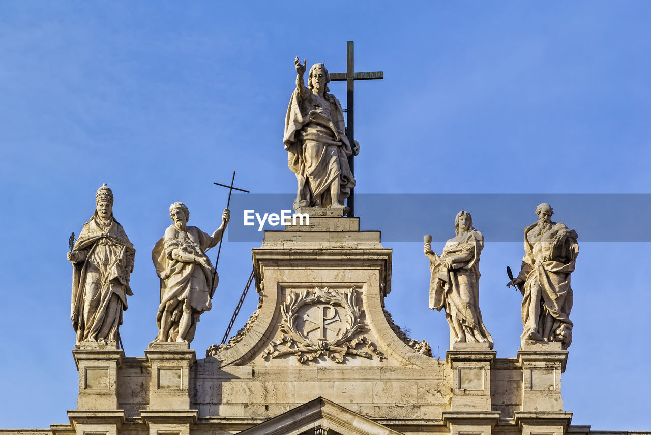 LOW ANGLE VIEW OF ANGEL STATUE AGAINST BLUE SKY