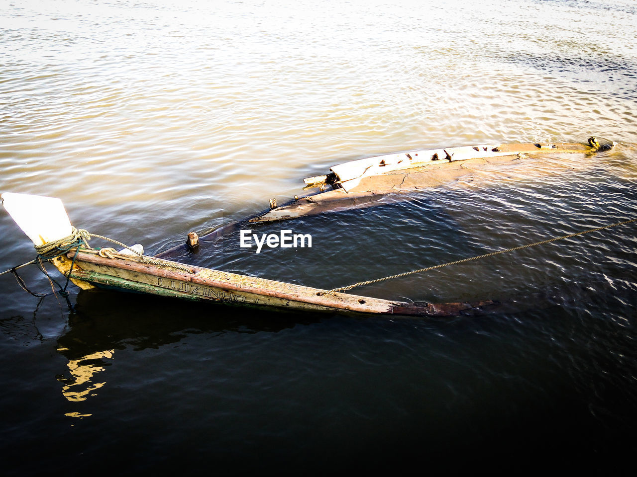 High angle view of shipwreck sinking in sea