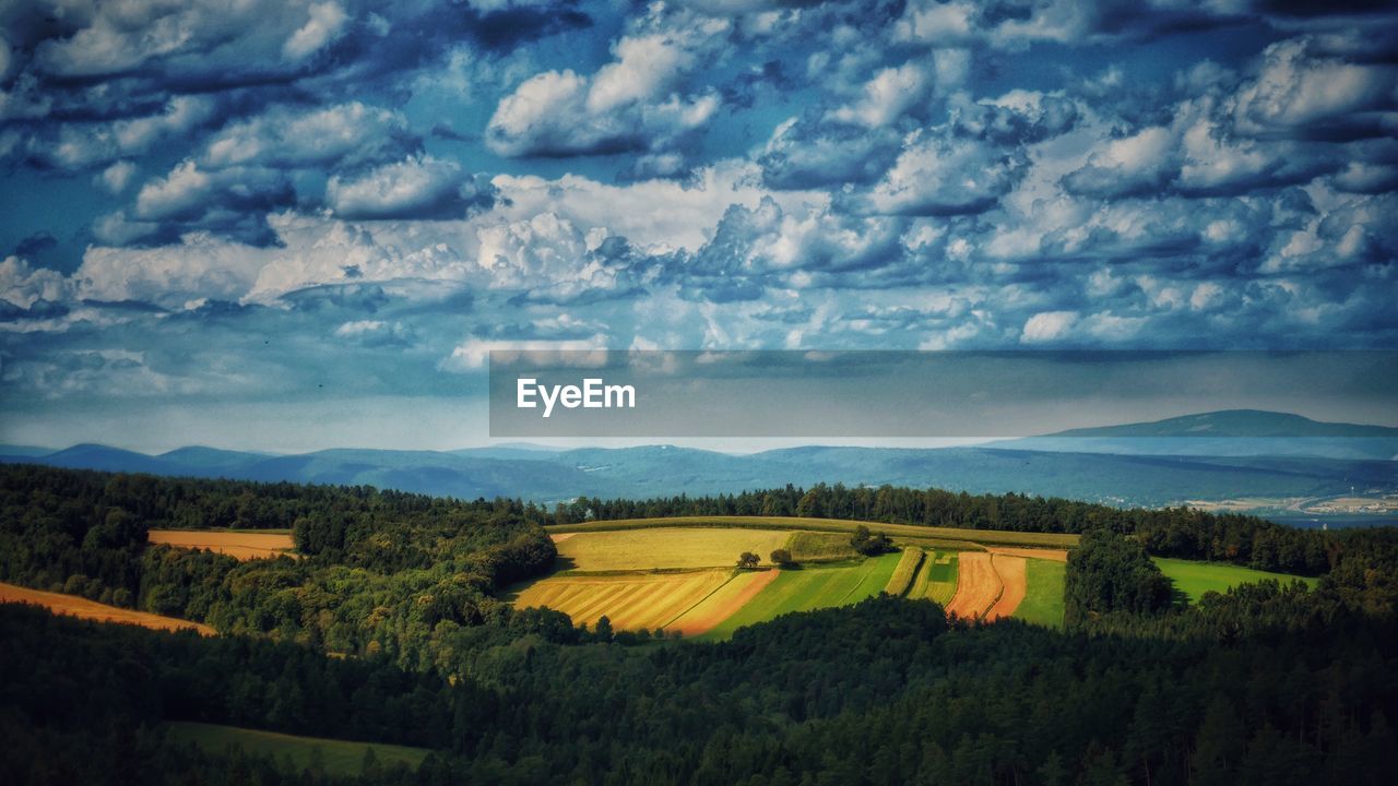 VIEW OF LANDSCAPE AGAINST CLOUDY SKY