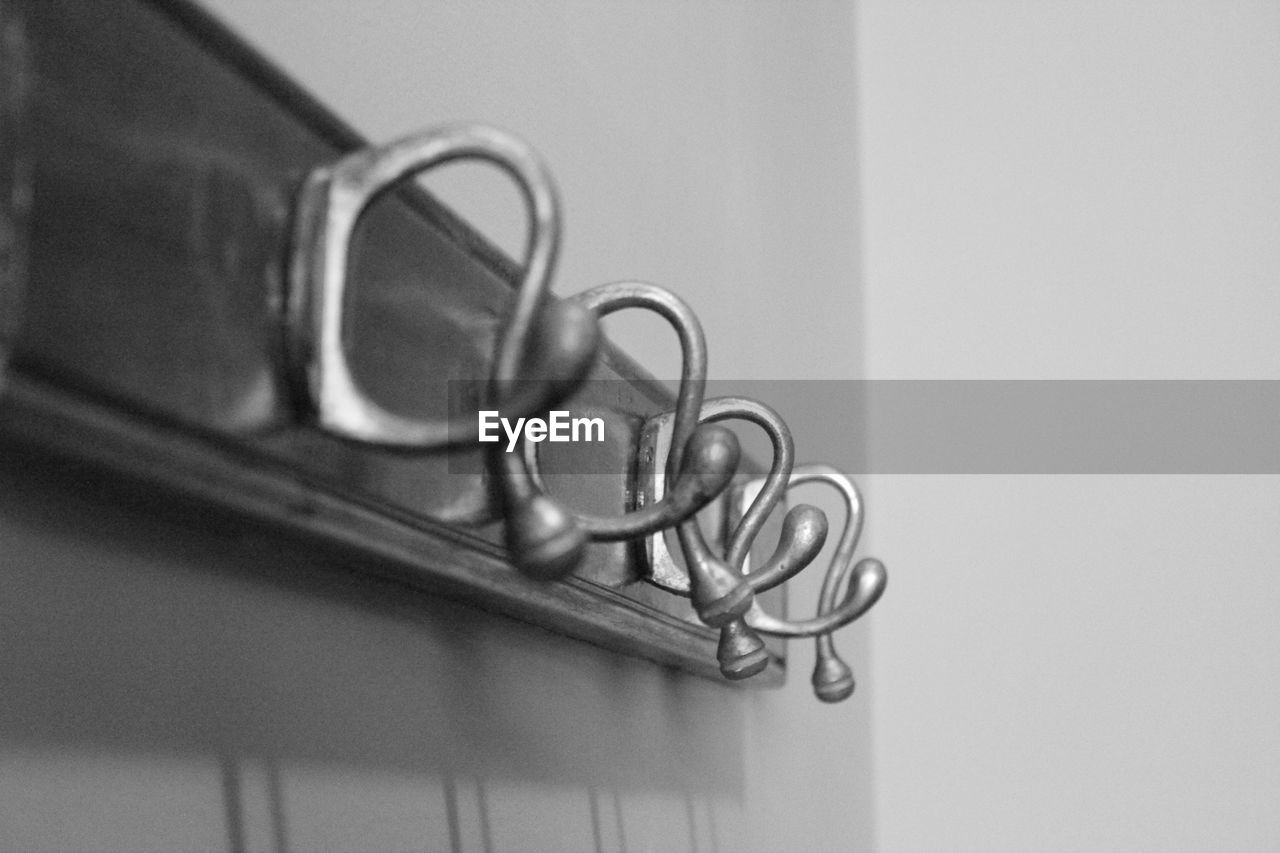 Close-up of hooks on wall