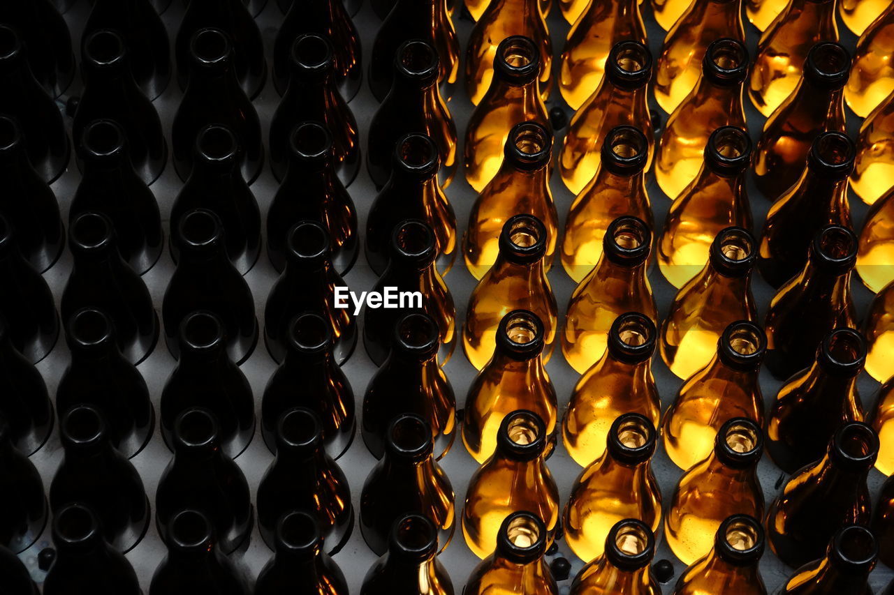 FULL FRAME SHOT OF WINE BOTTLES IN GLASS