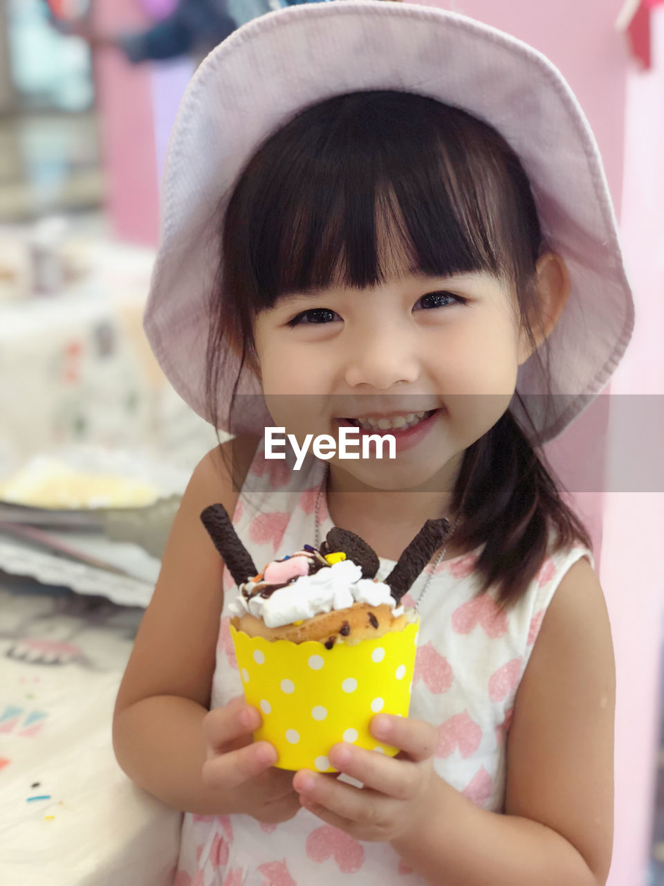 Portrait of smiling girl holding ice cream
