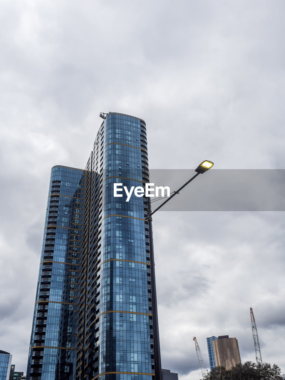 architecture, built structure, building exterior, city, sky, building, office building exterior, skyscraper, tower block, low angle view, cloud, urban area, office, tower, business, nature, blue, skyline, no people, street, residential district, cityscape, street light, landscape, travel destinations, outdoors, downtown district, city life, construction industry, development, landmark, metropolitan area, business finance and industry, metropolis, industry, day, urban skyline, travel, finance