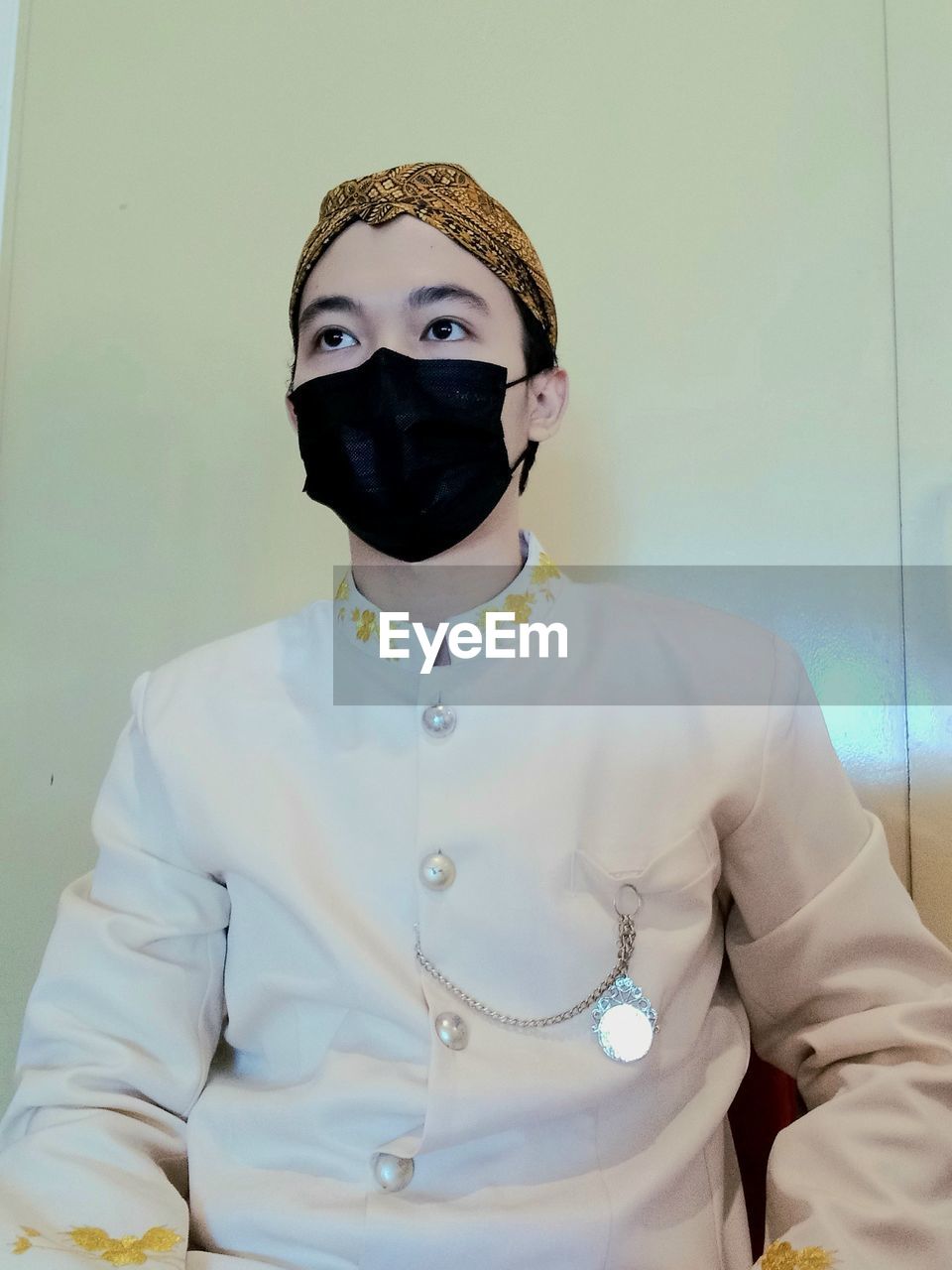 one person, clothing, portrait, indoors, front view, looking at camera, adult, disguise, waist up, mask, men, person, mask - disguise, occupation, young adult, costume, standing, obscured face, healthcare and medicine, human face, protective mask - workwear