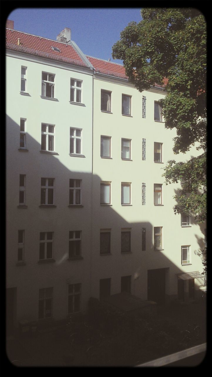 Sunlight and shadow on building facade