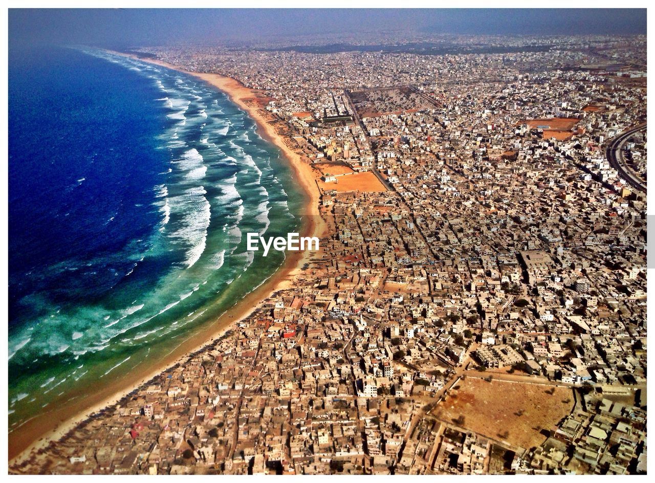 High angle view of residential district by sea