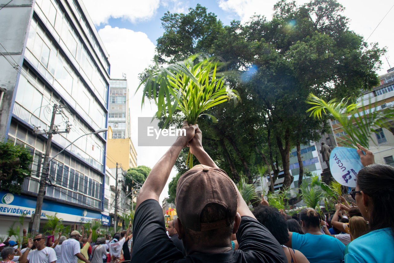 
catholics are seen participating in the palm sunday procession in the city of salvador, bahia.