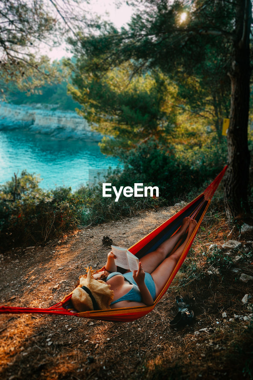 Woman lying down on shore