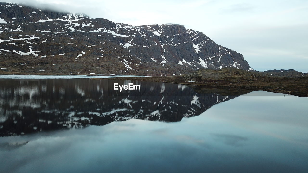 SCENIC VIEW OF SNOW COVERED MOUNTAIN RANGE