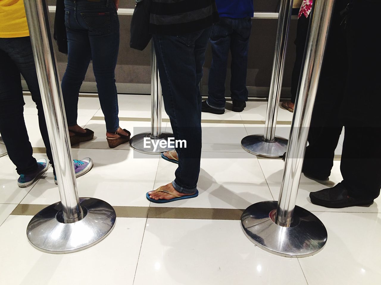 Low section of people standing on floor