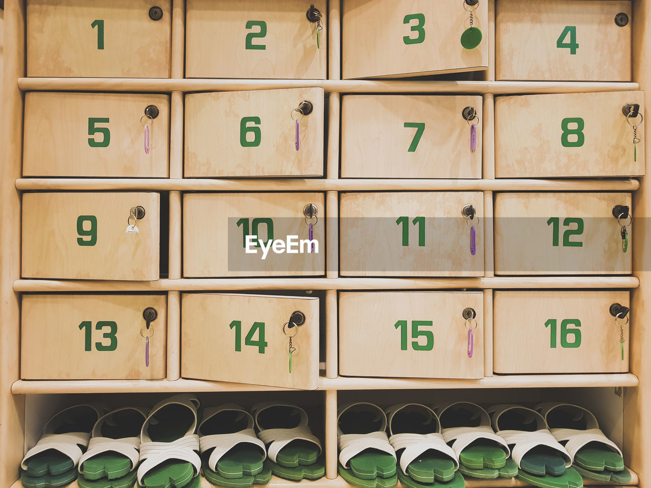 Footwear on shelves below lockers