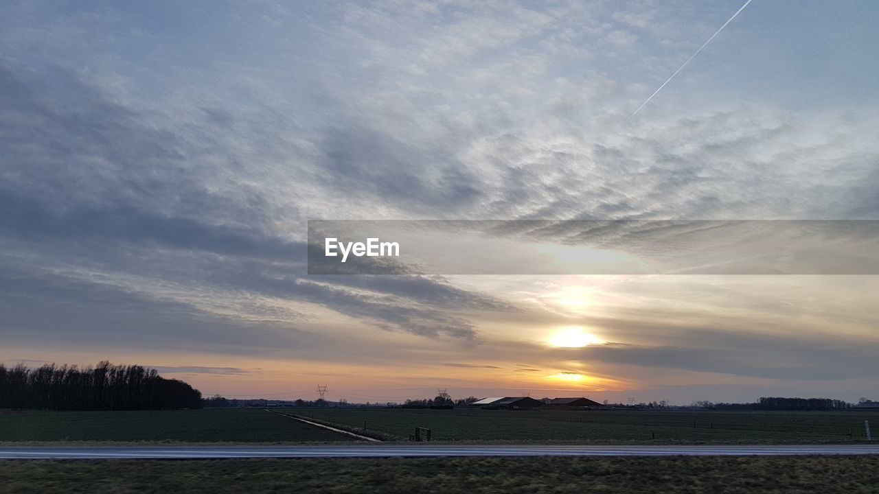 SILHOUETTE LANDSCAPE AGAINST SKY DURING SUNSET