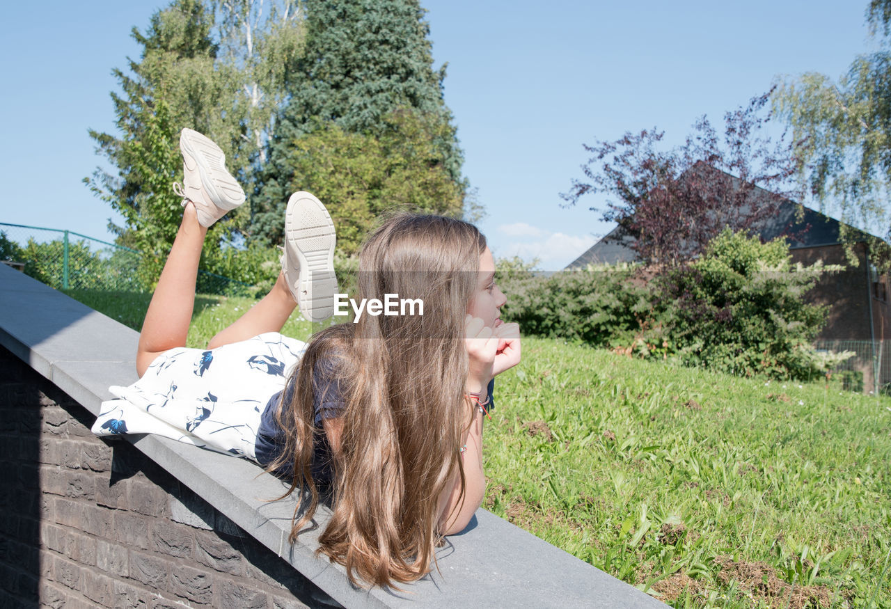 Teenage girl with imperfect skin grimaces at the camera, generation z, zoomers