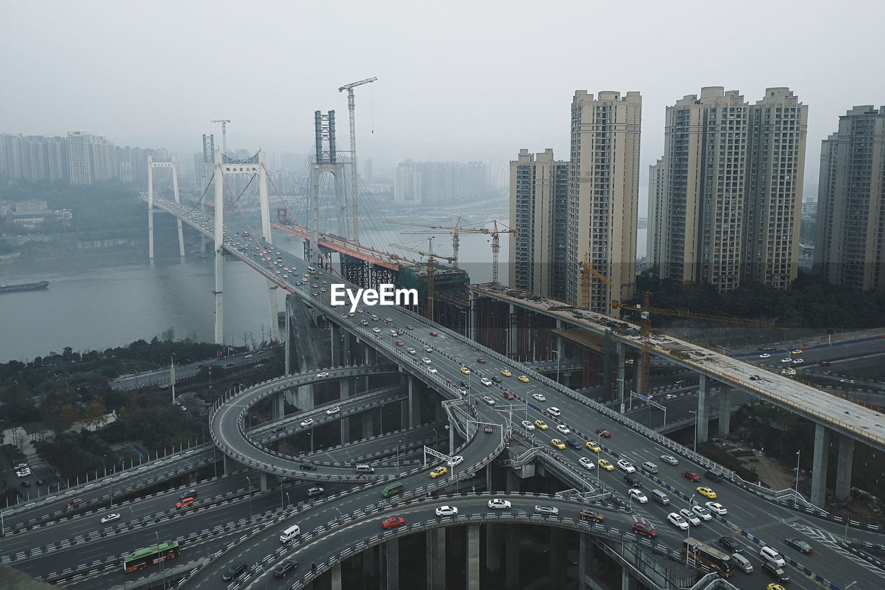 High angle view of bridge and buildings in city