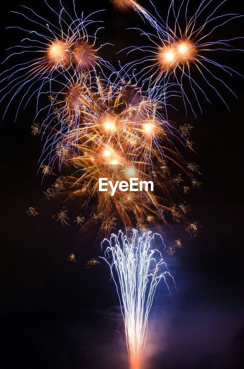 LOW ANGLE VIEW OF FIREWORKS DISPLAY