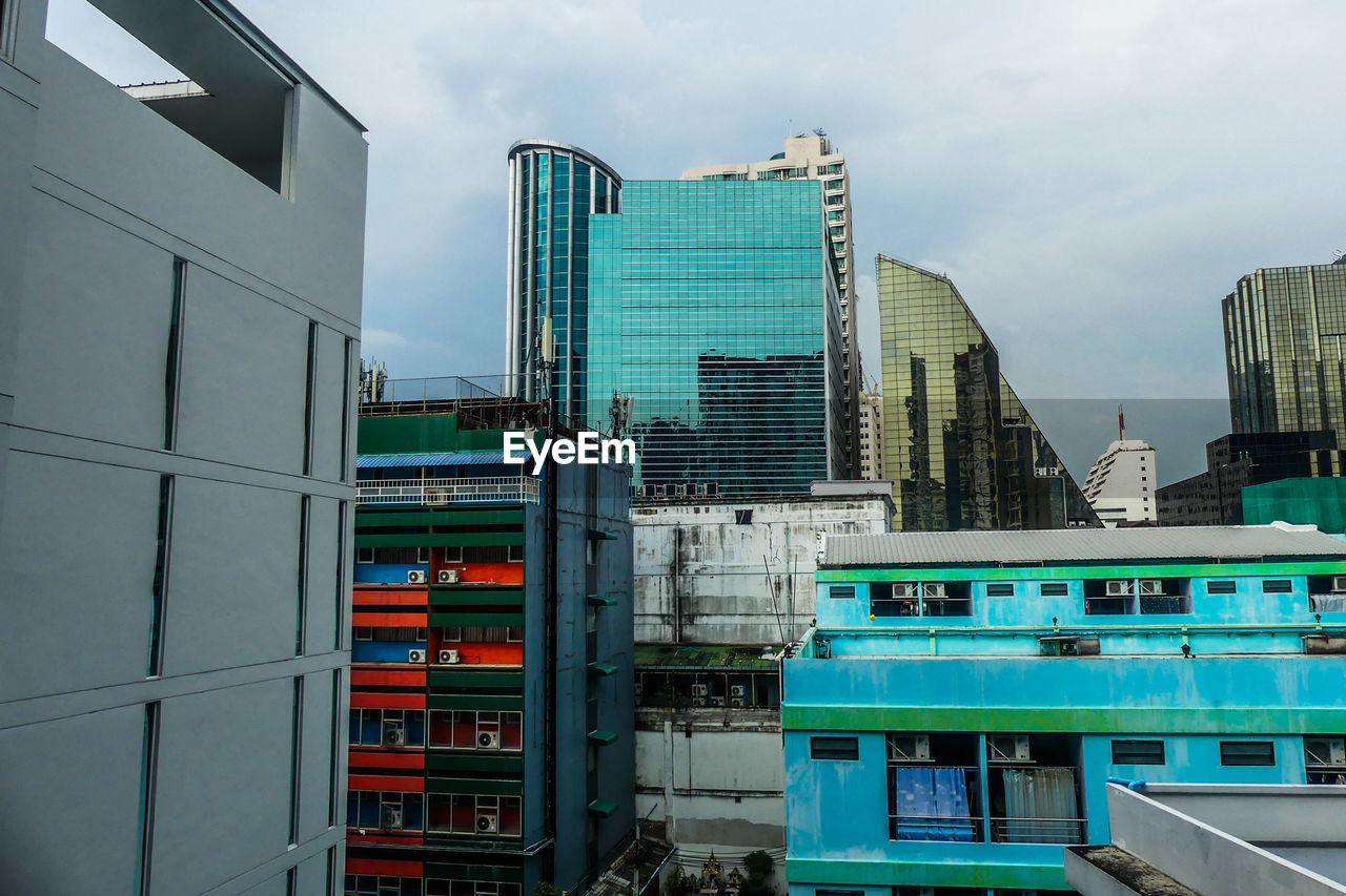 BUILDINGS IN CITY AGAINST SKY