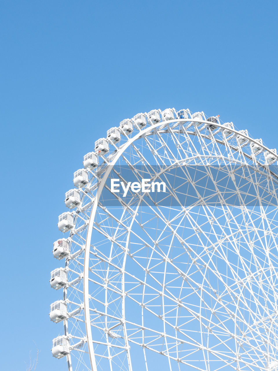low angle view of modern building against clear blue sky