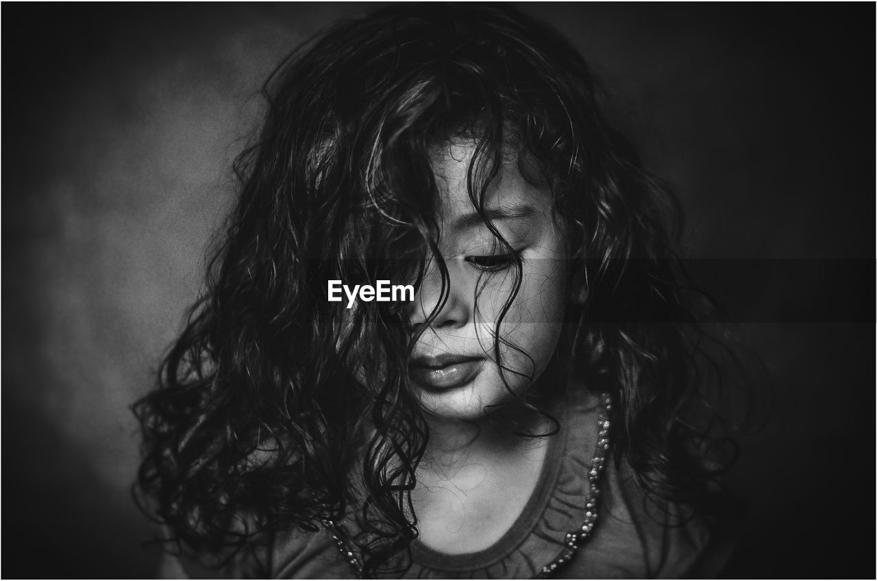 Close-up of girl with curly hair