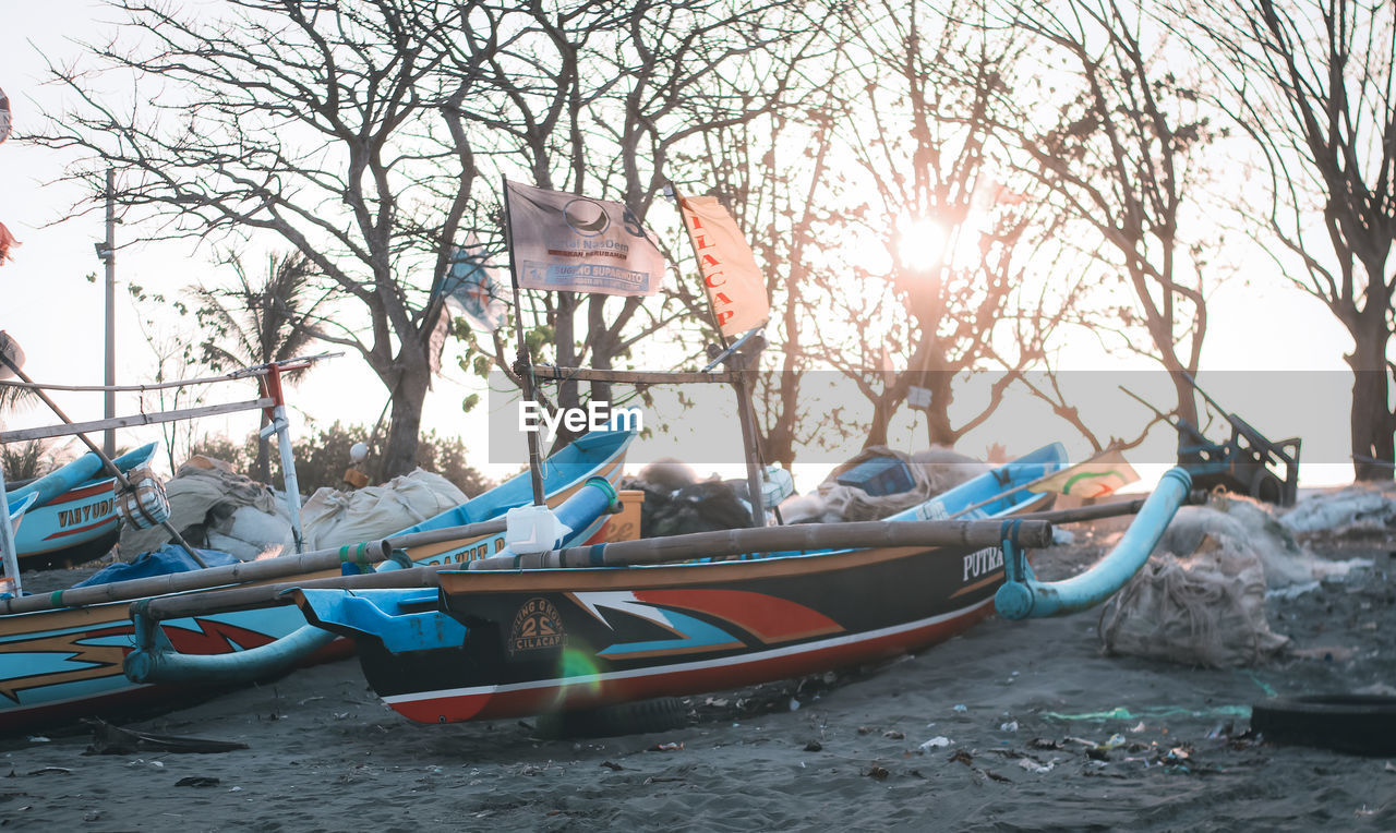 BOATS MOORED ON SHORE