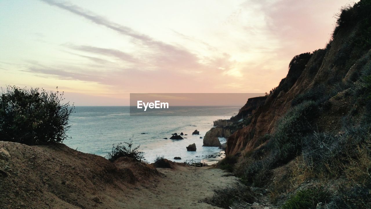 Scenic view of sea at sunset